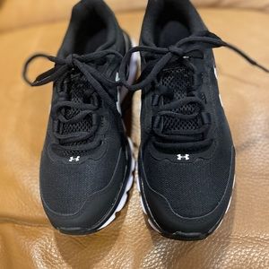 Woman’s Under Armour Charged Assert 9 running shoes